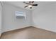 Well-lit bedroom featuring tile flooring, a ceiling fan, and a window offering natural light at 1436 Nolton Way, Orlando, FL 32822