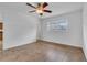 Bright bedroom with tile flooring, ceiling fan, and a window, creating a comfortable living space at 1436 Nolton Way, Orlando, FL 32822