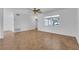 Bright living room featuring tile floors, neutral walls, ceiling fan, and a window with a front yard view at 1436 Nolton Way, Orlando, FL 32822