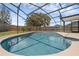 This inviting pool boasts a screened enclosure, concrete deck, and pristine blue water at 1436 Nolton Way, Orlando, FL 32822