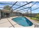 Relaxing pool area with screened enclosure, concrete deck, and well-maintained landscaping at 1436 Nolton Way, Orlando, FL 32822