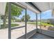 Screened-in porch offering an outdoor view with ample natural light and a glimpse of the neighborhood at 1436 Nolton Way, Orlando, FL 32822