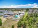 Expansive aerial view of a luxurious home featuring a beautiful pool and manicured landscaping in a tranquil community at 15121 Pendio Dr, Montverde, FL 34756