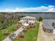 Breathtaking aerial view of a luxury home with lush landscaping and lake views, offering a serene and upscale living experience at 15121 Pendio Dr, Montverde, FL 34756