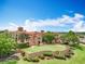 Spectacular aerial view of a grand estate featuring a lush lawn, mature trees, and impeccable landscaping at 15121 Pendio Dr, Montverde, FL 34756