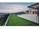 Home showcasing a spacious, manicured lawn and patio with scenic views, perfect for outdoor enjoyment at 15121 Pendio Dr, Montverde, FL 34756