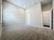 A spacious bedroom with a neutral color scheme, plush carpeting, and ample natural light creates a calming atmosphere at 15121 Pendio Dr, Montverde, FL 34756