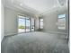 This spacious bedroom features a tray ceiling, large windows, recessed lighting and access to a private balcony at 15121 Pendio Dr, Montverde, FL 34756