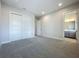 Neutral bedroom with large sliding closet doors, plush carpeting, and recessed lighting at 15121 Pendio Dr, Montverde, FL 34756