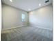Bedroom featuring neutral walls, plush carpeting, recessed lighting, and a large window at 15121 Pendio Dr, Montverde, FL 34756