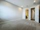 Bedroom featuring plush carpeting, recessed lighting, ensuite bathroom, and neutral walls at 15121 Pendio Dr, Montverde, FL 34756
