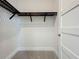 Walk-in closet featuring a sleek black closet organizer and neutral walls at 15121 Pendio Dr, Montverde, FL 34756