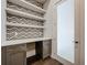 Desk area with custom shelves and chevron backsplash at 15121 Pendio Dr, Montverde, FL 34756