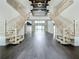 Elegant two-story foyer featuring a double staircase, sleek hardwood floors, and a welcoming open-concept design at 15121 Pendio Dr, Montverde, FL 34756