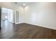 An open-concept living area features sleek hardwood floors and expansive space with a modern, minimalist design at 15121 Pendio Dr, Montverde, FL 34756