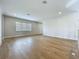 A bright and spacious living area showcases hardwood floors, recessed lighting, and ample natural light with multiple windows at 15121 Pendio Dr, Montverde, FL 34756