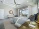 This beautiful main bedroom features a sitting area, tray ceiling, fan, and access to a private balcony at 15121 Pendio Dr, Montverde, FL 34756