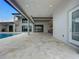Large covered outdoor patio and kitchen area adjacent to the pool, perfect for relaxation and hosting at 15121 Pendio Dr, Montverde, FL 34756