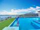 Breathtaking infinity pool offers lake views, seamlessly blending luxury living with serene waterfront elegance at 15121 Pendio Dr, Montverde, FL 34756
