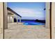 Luxury backyard featuring a pool with lake views at 15121 Pendio Dr, Montverde, FL 34756