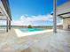 Beautiful swimming pool surrounded by a patio with waterfront views at 15121 Pendio Dr, Montverde, FL 34756