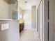 This is a full bathroom with a tub, shower, vanity and tiled flooring at 15341 Groose Point Ln, Clermont, FL 34714