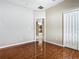 This is a bedroom featuring wood look tile and a large closet at 15341 Groose Point Ln, Clermont, FL 34714