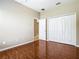 Bedroom with wood-look tile flooring and a closet at 15341 Groose Point Ln, Clermont, FL 34714