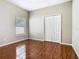 Bedroom with a window and wood-look tile flooring at 15341 Groose Point Ln, Clermont, FL 34714