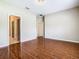 Spacious living room featuring wood-look tile floors and neutral walls at 15341 Groose Point Ln, Clermont, FL 34714