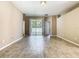 Bright living room featuring tile floors and sliding glass doors to the backyard at 15341 Groose Point Ln, Clermont, FL 34714