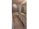 Bathroom showcasing tile flooring, a granite vanity, and a tiled shower/tub combo at 1556 Aspen Ave, Davenport, FL 33837