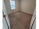 Empty bedroom with carpet flooring and window at 1556 Aspen Ave, Davenport, FL 33837