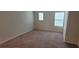 Bedroom with carpet flooring and natural light at 1556 Aspen Ave, Davenport, FL 33837
