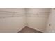 A walk-in closet with carpet and wire shelving at 1556 Aspen Ave, Davenport, FL 33837