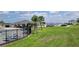 Inviting community pool area with lush green space, seating, and covered lounge areas at 1556 Aspen Ave, Davenport, FL 33837