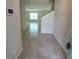 Foyer features tiled floors and a modern aesthetic at 1556 Aspen Ave, Davenport, FL 33837