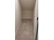 Walk-in pantry with tiled floor and open shelving, perfect for optimizing storage at 1556 Aspen Ave, Davenport, FL 33837