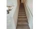 Carpeted staircase leads to the upper level at 1556 Aspen Ave, Davenport, FL 33837