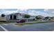 Street view of community landscaping with sidewalks and stylish homes in the Forest Lakes Community at 1556 Aspen Ave, Davenport, FL 33837