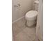 Enclosed toilet with ceramic tile flooring at 1556 Aspen Ave, Davenport, FL 33837
