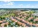A high angle shot of a quiet community with beautiful mature trees and landscaping at 16614 Lazy Breeze Loop, Clermont, FL 34714