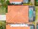 Aerial view showcases the layout and tiled roof of this property, with screened-in pool at 16614 Lazy Breeze Loop, Clermont, FL 34714