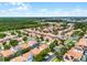 A high angle shot of a quiet community with beautiful mature trees and landscaping at 16614 Lazy Breeze Loop, Clermont, FL 34714