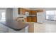 Bright kitchen featuring a breakfast bar, ample counter space, and white appliances at 16614 Lazy Breeze Loop, Clermont, FL 34714