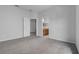 Spacious main bedroom with neutral carpet and an ensuite bathroom, offering a private retreat at 16614 Lazy Breeze Loop, Clermont, FL 34714