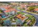Aerial view of a playground and outdoor activity areas nestled within a residential community at 16614 Lazy Breeze Loop, Clermont, FL 34714