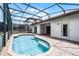 Inviting screened-in pool features brick trim and deck, and provides a private outdoor oasis at 16614 Lazy Breeze Loop, Clermont, FL 34714