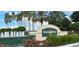 Kings Ridge community sign with fountain, flowers and palm trees at 2312 Twickingham Ct, Clermont, FL 34711