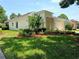 A beautiful property with well manicured lawn and shrubbery at 2312 Twickingham Ct, Clermont, FL 34711